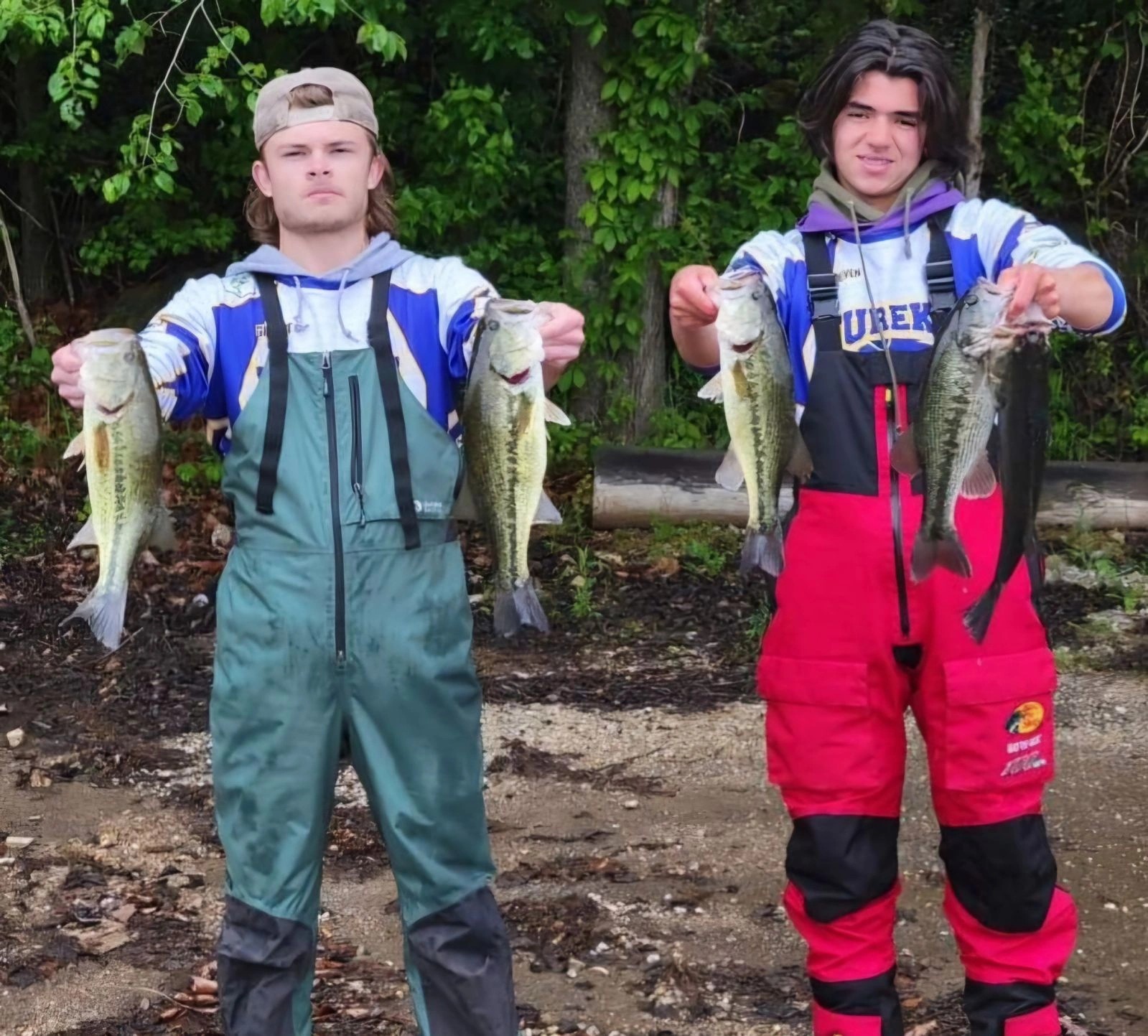 Two young anglers holding their bass